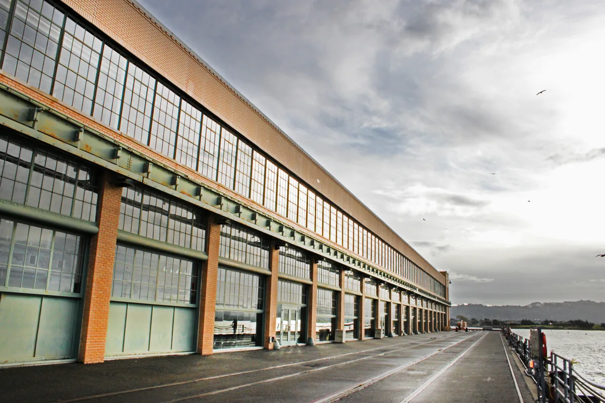 Historic Ford Assembly Plant brick and steel waterfront facade beside the promenade in Richmond, California. — destination photo, not the race course