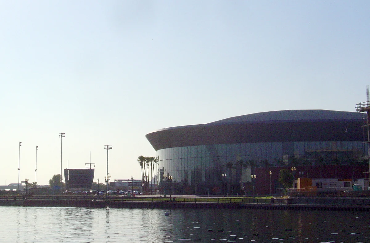 Stockton's curved-roof waterfront arena beside the water, photographed in 2006 Destination photo. Not the club or its route.